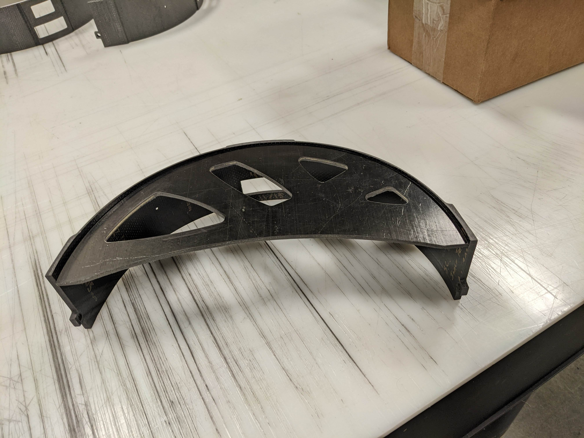 Curved composite support bracket
